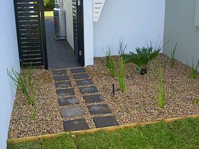 Paved step stones in garden Northern Land Design