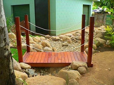 Wooden bridge in yard Northern Land Design