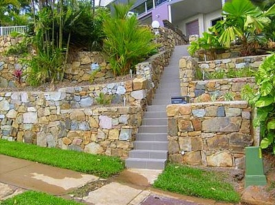 Stone walls and stairs to house Northern Land Design